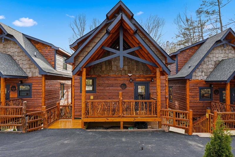 Beautiful log cabin exterior featuring rustic charm with natural wood siding, covered porch, and mountainstyle architecture.