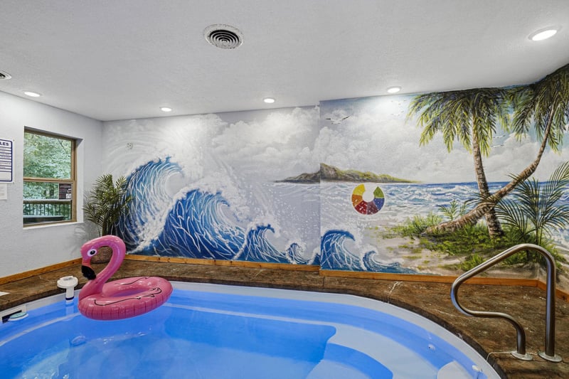 Soak away your cares in your private hot tub, surrounded by vibrant tropical murals that bring a playful beachside escape indoors.
