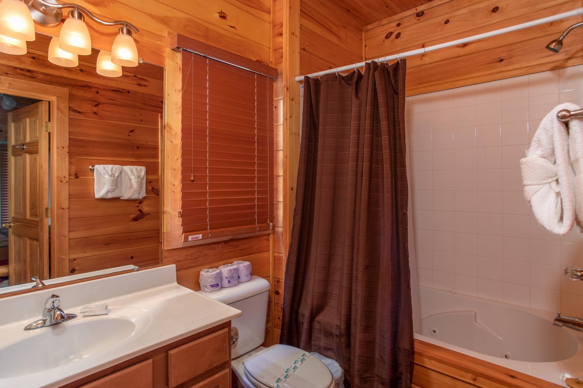 Bathroom with a tub and shower at Four Seasons Lodge, a 3bedroom cabin rental located in Pigeon Forge