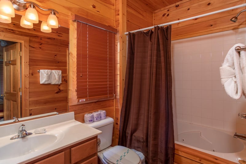 Bathroom with a tub and shower at Four Seasons Lodge, a 3bedroom cabin rental located in Pigeon Forge