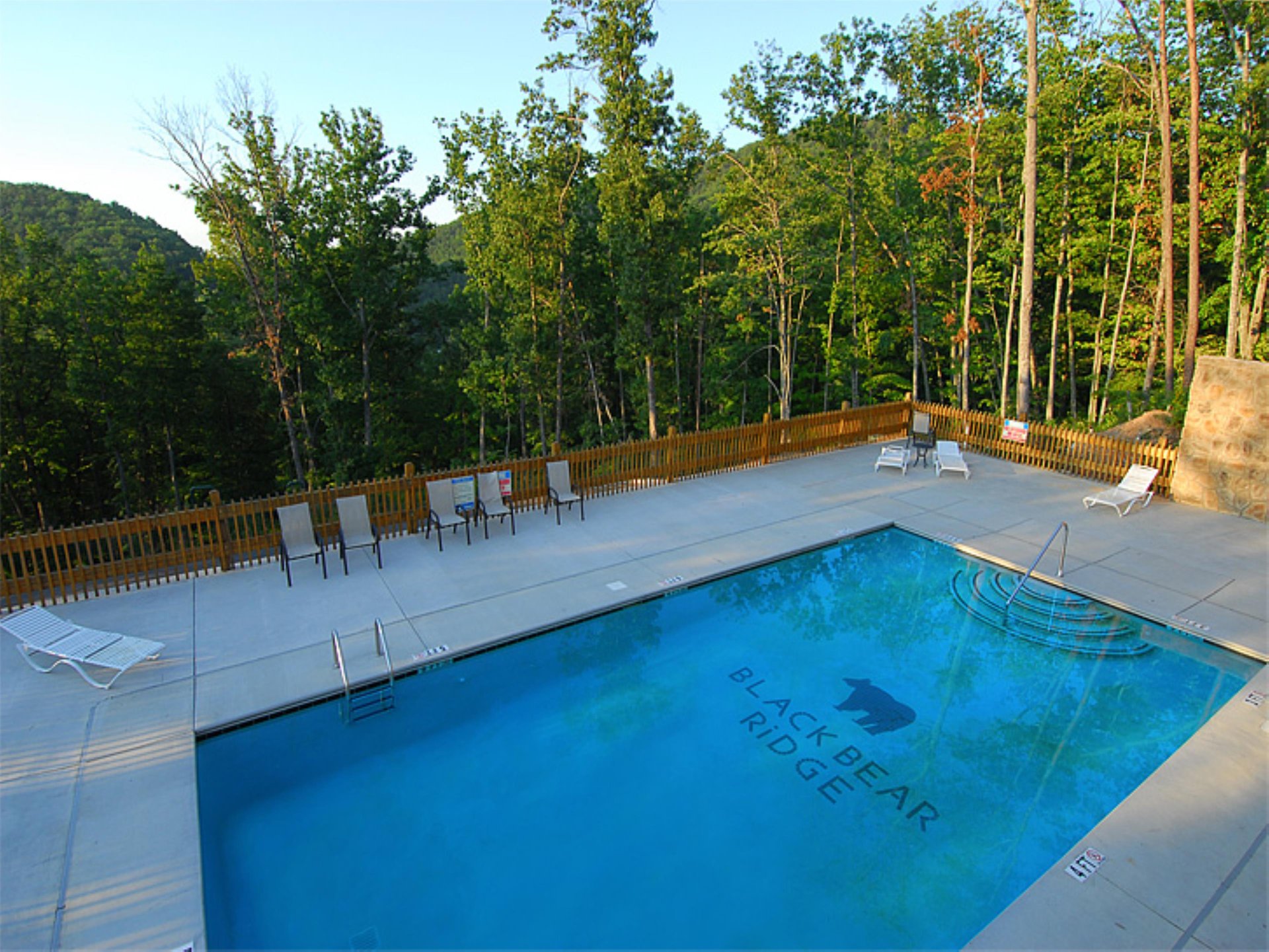 Dive into crystalclear waters surrounded by lush mountain forests. Your private pool oasis awaits with comfortable loungers and stunning natural views.