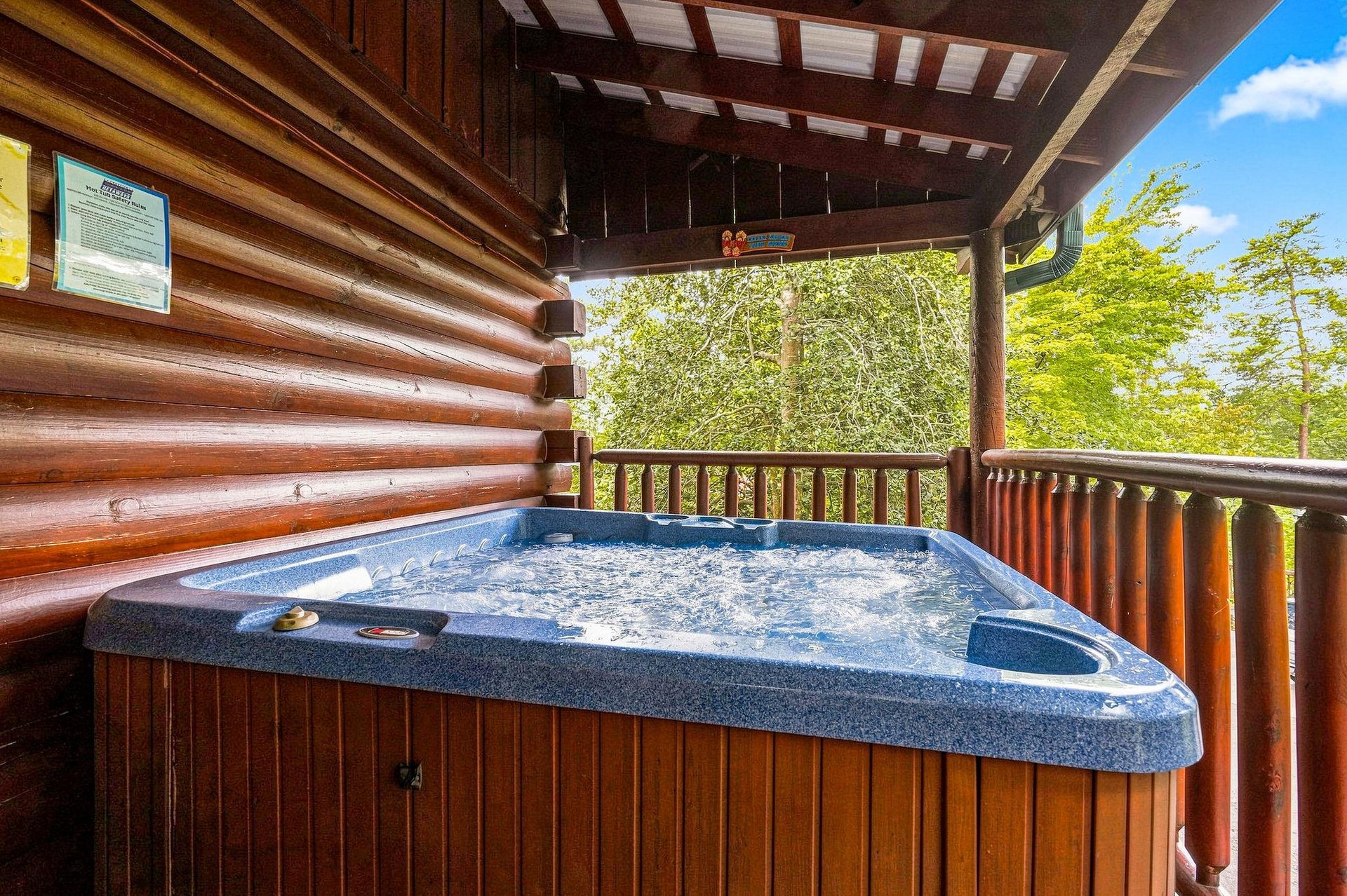 Slip into your private hot tub and let the warm, bubbling water melt away the day as you gaze out at the lush forest views from your covered deck.