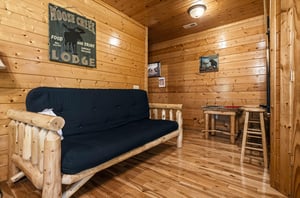 Unwind in your cozy cabin retreat with rustic log furnishings, warm pine walls, and a relaxed lodge atmosphere—perfect for quiet evenings after exploring the outdoors.