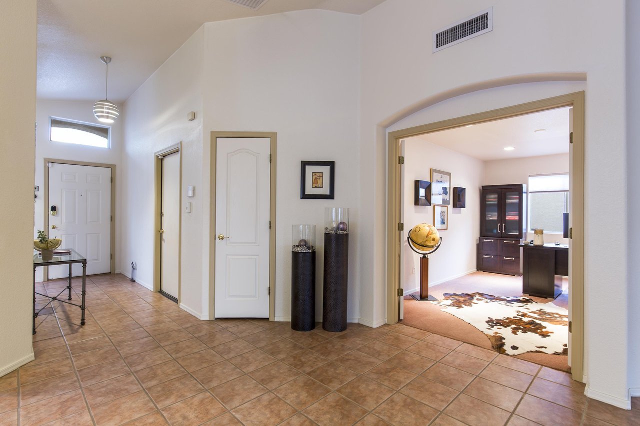 The office space is viewable just off the entryway.