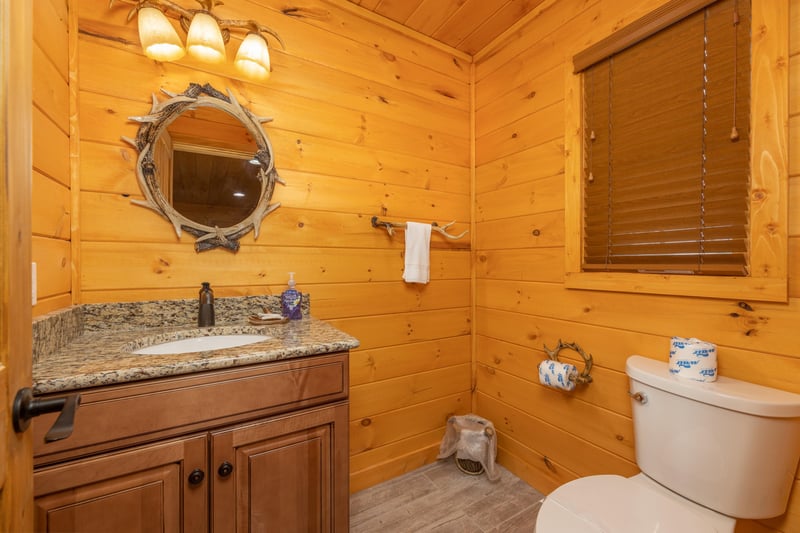 Half bath at Js Hideaway, a 4 bedroom cabin rental located in Pigeon Forge