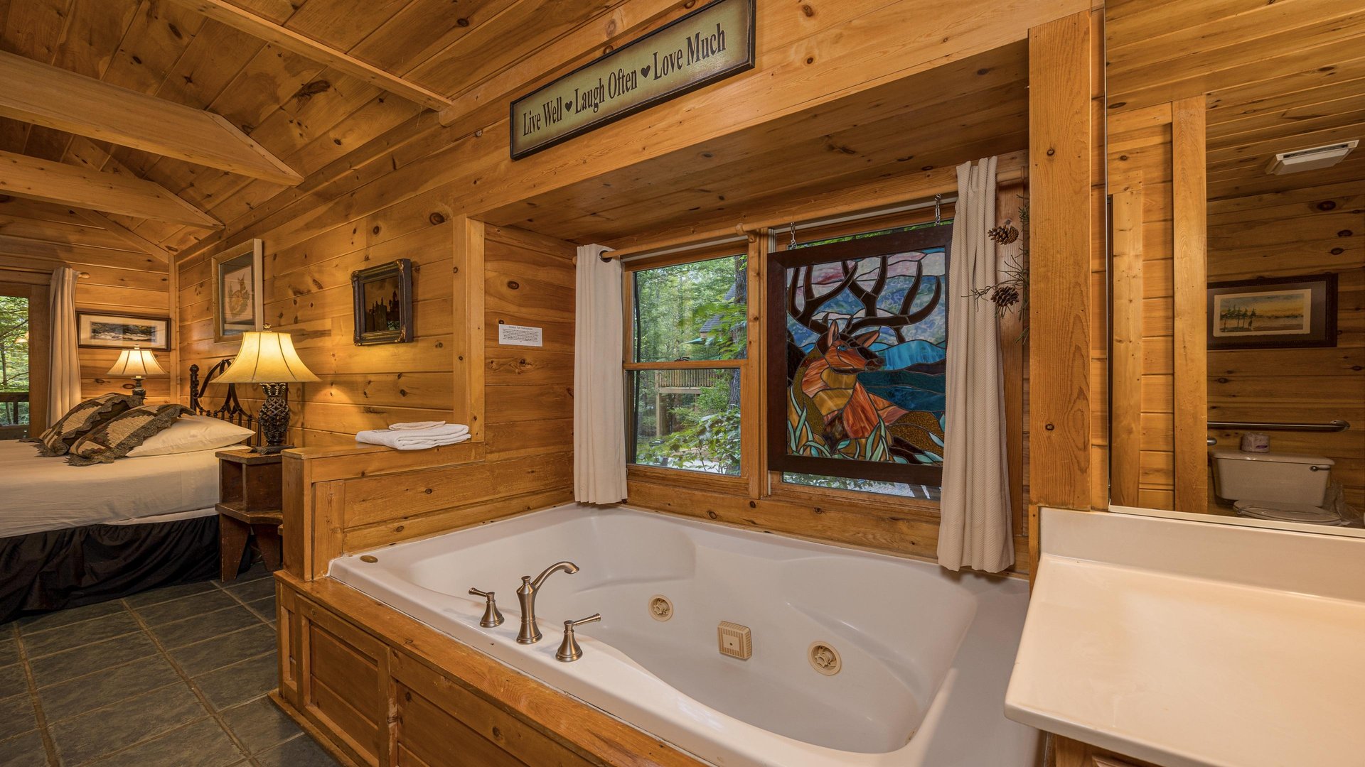 Soaker tub with stained glass window