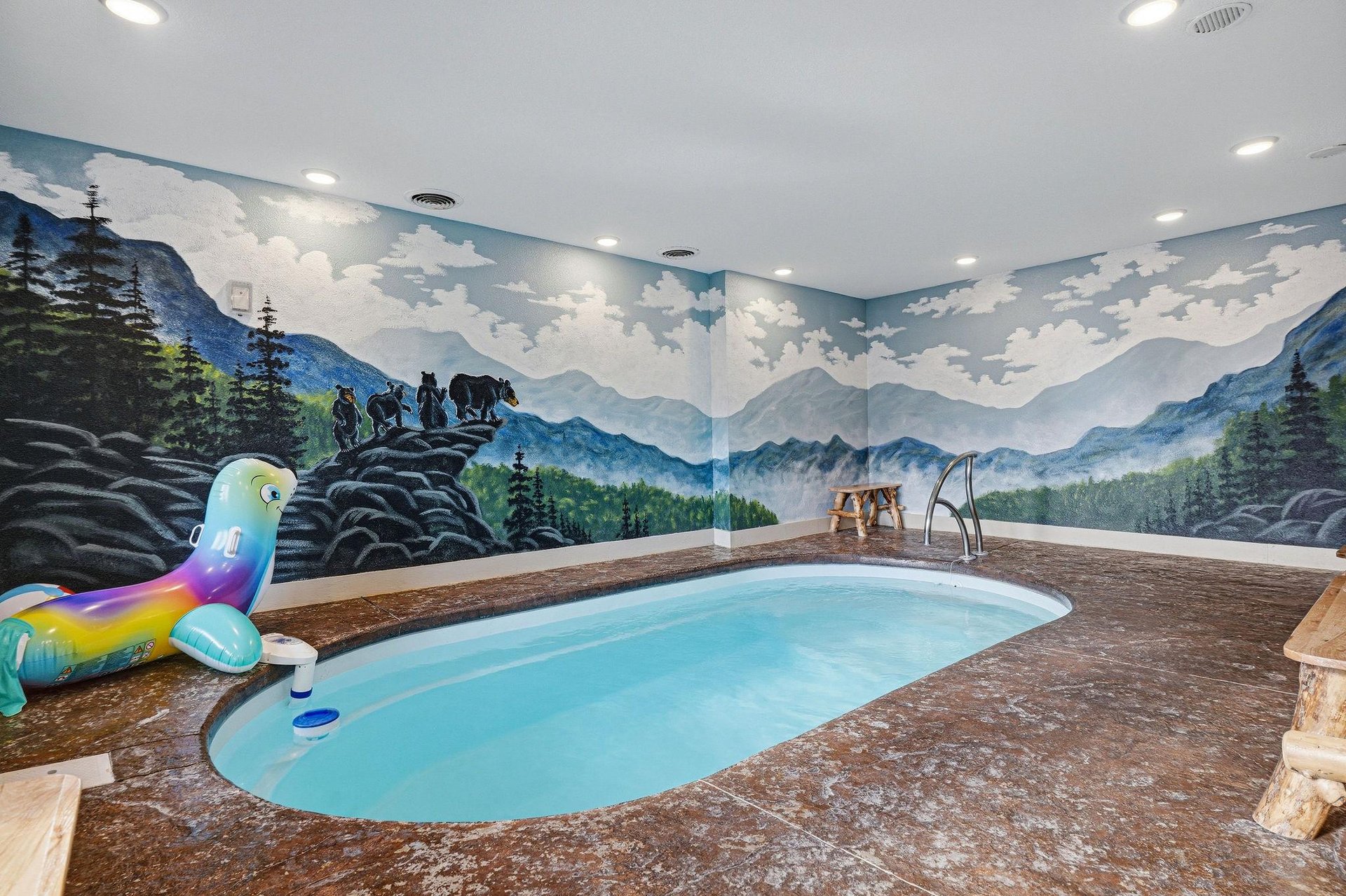 Your private indoor pool awaits, surrounded by stunning mountain murals that transport you to natures embrace while you swim and relax.