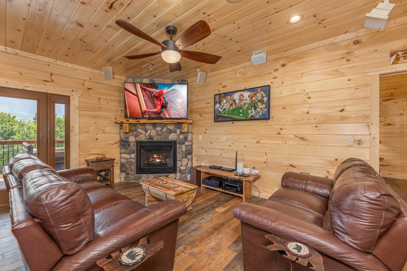 Living room with stone fireplace