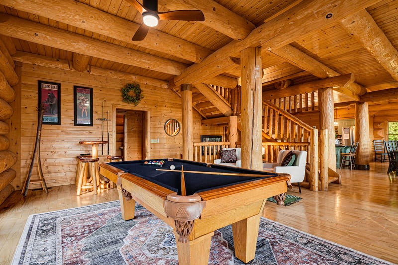 Gather around your own fullsize pool table beneath soaring log beams—a perfect retreat for friendly competition and laughter.