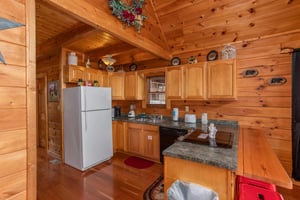 Fully equipped kitchen at Hibernation Station, a 3bedroom cabin rental located in Pigeon Forge
