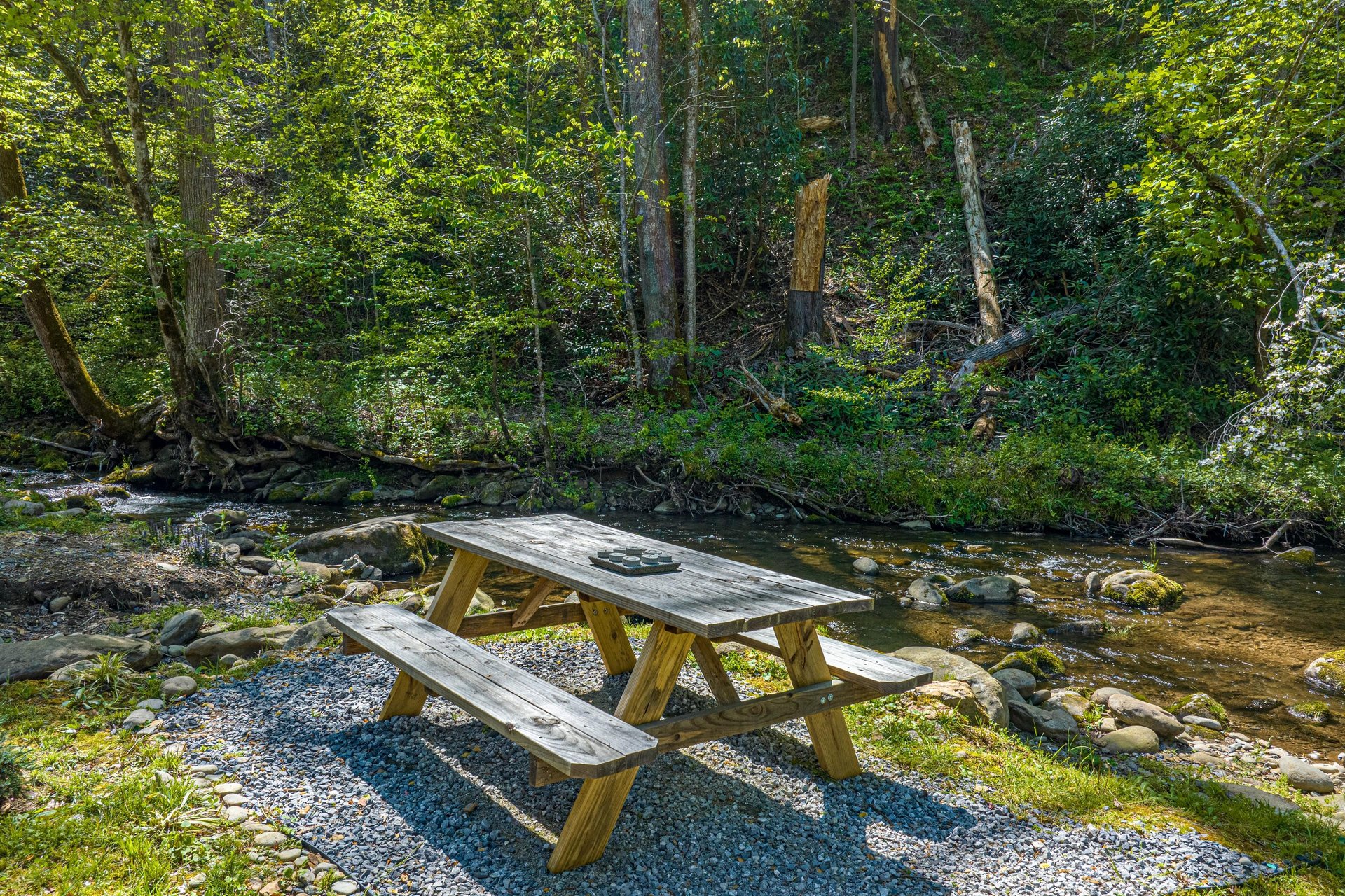 Picnic table beside creek