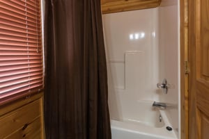 Upstairs bath with a tub and shower at Four Seasons Lodge, a 3bedroom cabin rental located in Pigeon Forge