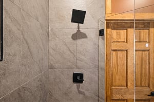 Enjoy a refreshing shower in your modern walkin enclosure with sleek fixtures and spacious tile design. Unwind after a day of adventure and prepare for more memories.