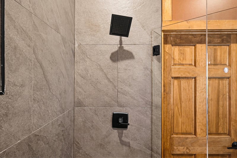 Enjoy a refreshing shower in your modern walkin enclosure with sleek fixtures and spacious tile design. Unwind after a day of adventure and prepare for more memories.