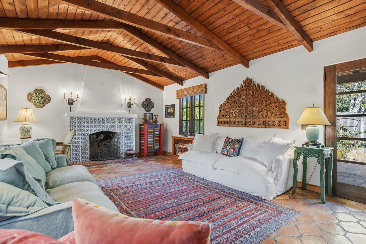 Ample seating, fireplace, and vaulted ceilings.