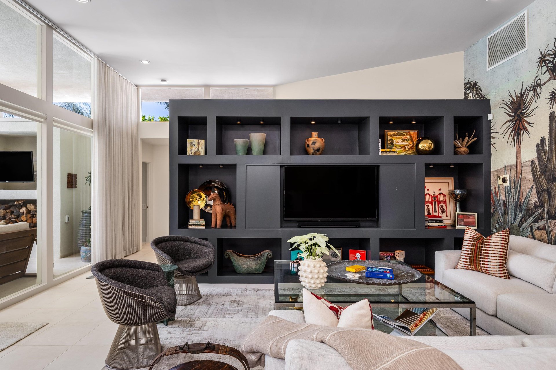 Spacious living room with ample seating and a flatscreen TV with streaming.