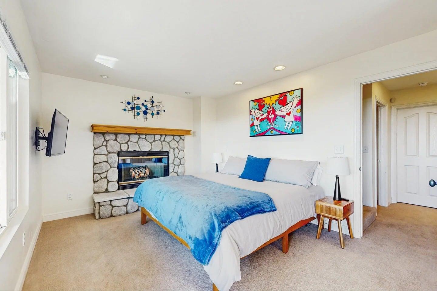 King size bed, smart TV, fireplace, private deck access, and ensuite bathroom.