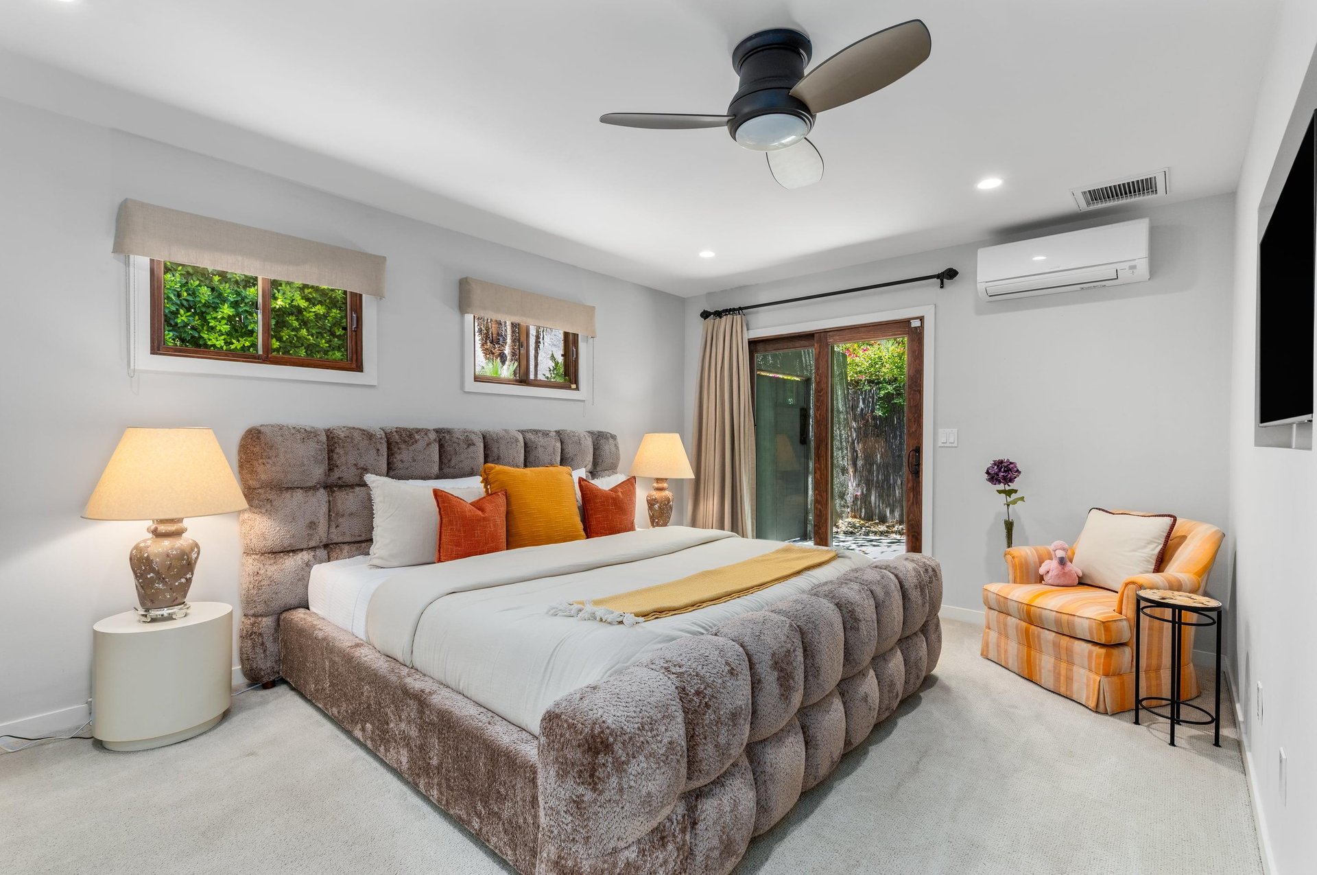 King bed, Smart TV, patio access, and ensuite bathroom.