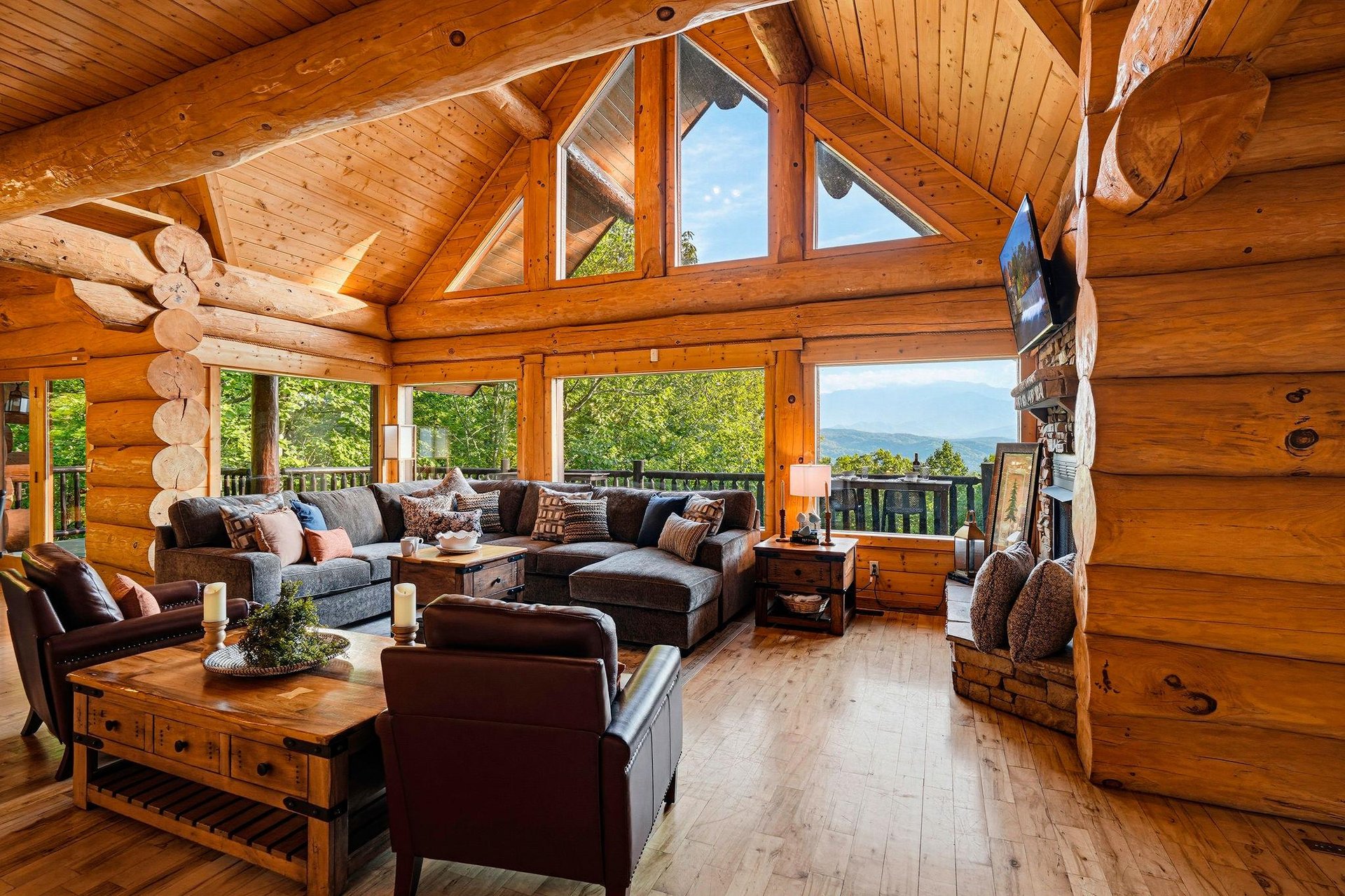Sink into the plush sectional and take in mountain vistas through soaring logframed windows. Rustic elegance meets comfort in your living space, where every detail invites you to unwind.