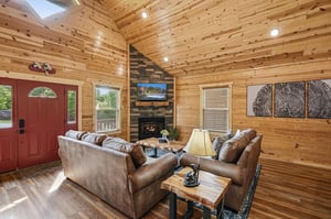 Sink into plush leather sofas by the crackling fireplace and admire stunning woodwork throughout your bright, airy living space. Perfect for unwinding after your mountain adventures.