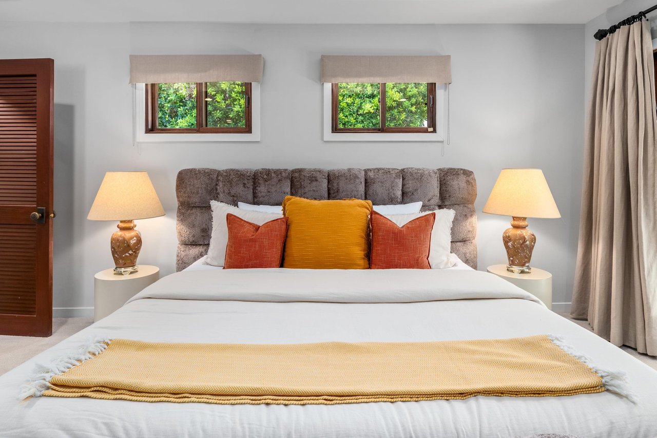 King bed, Smart TV, patio access, and ensuite bathroom.