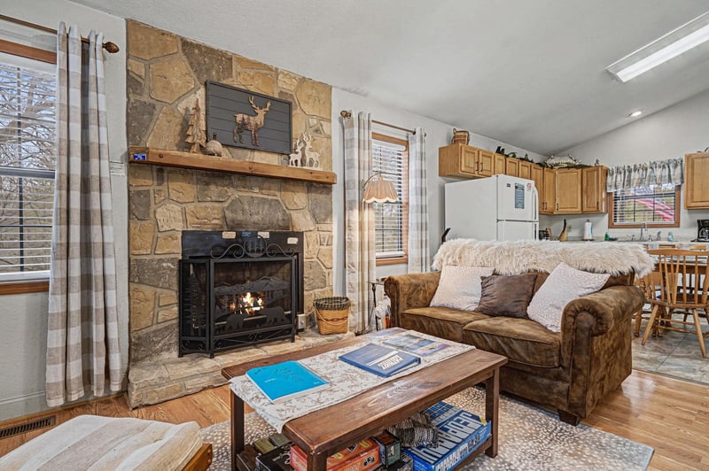 Curl up by your crackling stone fireplace while snow falls outside, creating the perfect cozy retreat after mountain adventures.