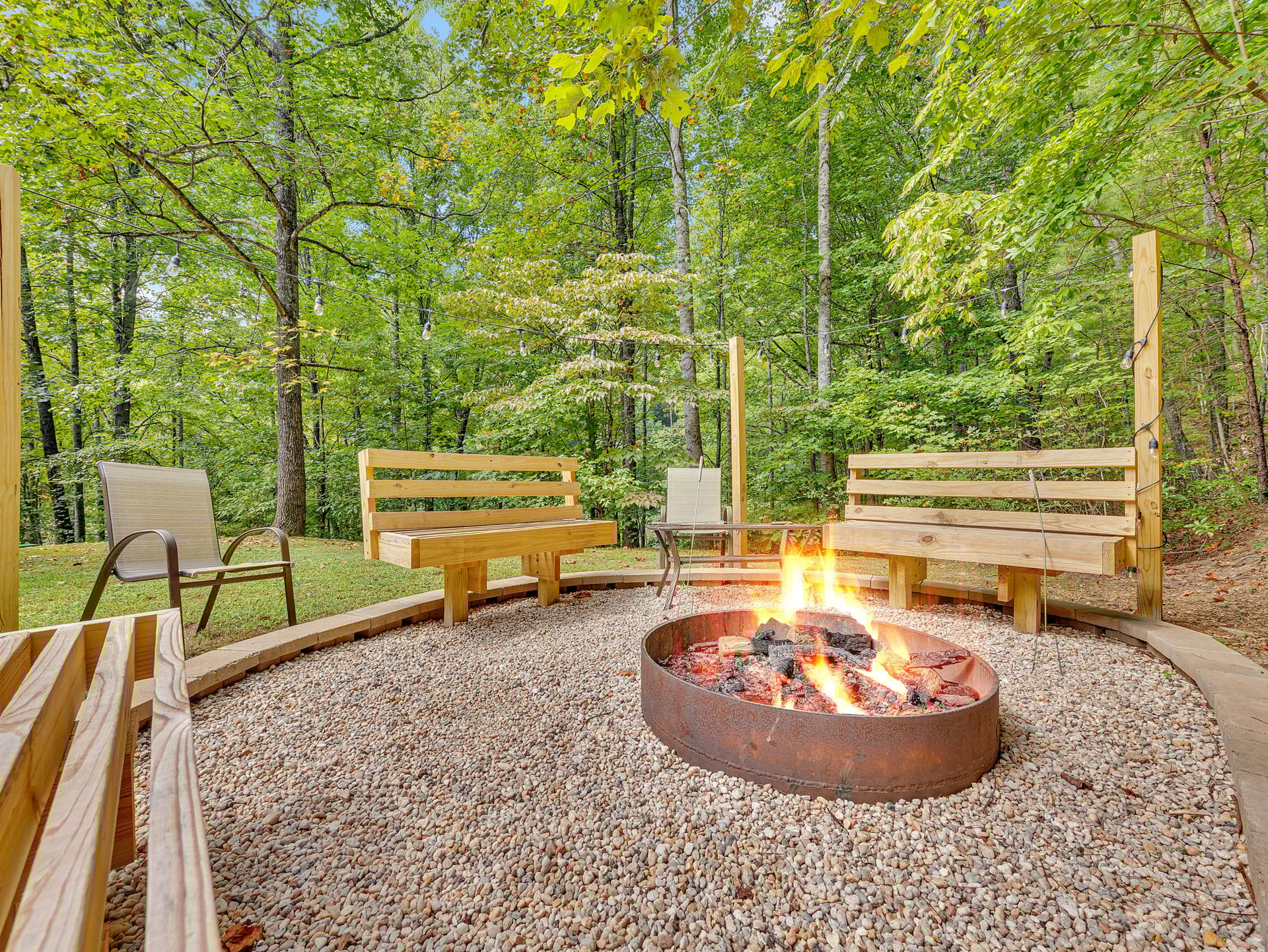 Gather around your private fire pit surrounded by forest serenity, where crackling flames and woodland sounds create the perfect evening retreat.