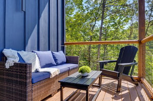 Settle into your private deck and let the forest envelop you in tranquility. Comfortable seating invites lazy afternoons with a book, while the fresh woodland air whispers through the trees.