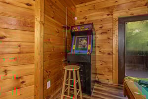 Arcade game with stool