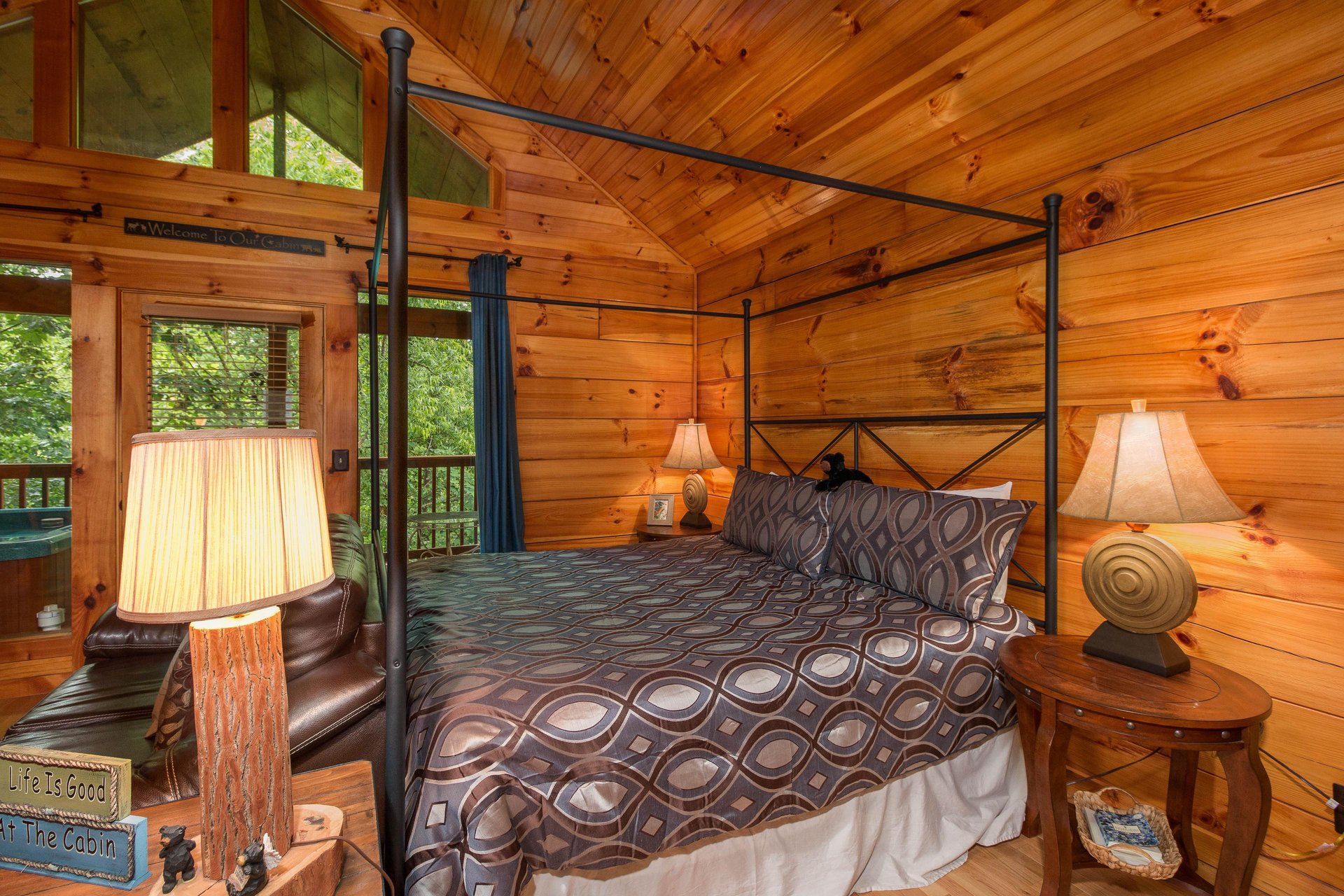 Main bed in the studio style cabin at Kellys Cabin, a 1 bedroom cabin rental located in Pigeon Forge