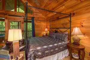 Main bed in the studio style cabin at Kellys Cabin, a 1 bedroom cabin rental located in Pigeon Forge