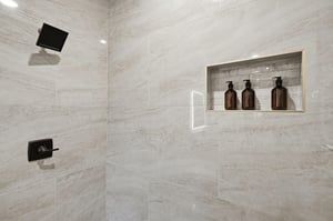 Step into your luxurious marble shower with premium amenities and sleek black fixtures for an indulgent spalike experience.