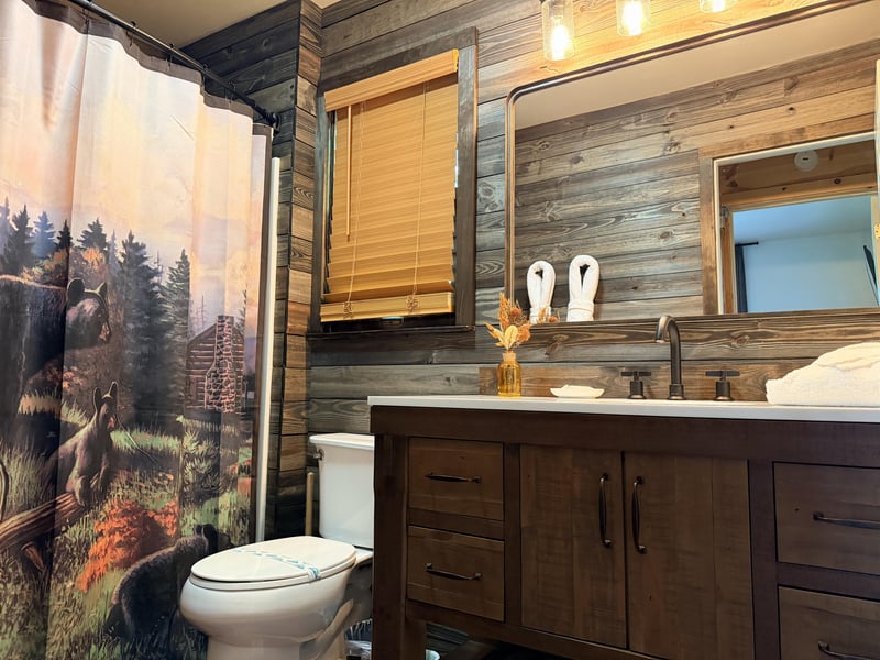 Rustic wood walls and forestinspired touches create a cozy retreat where you can relax and refresh after your mountain adventures.