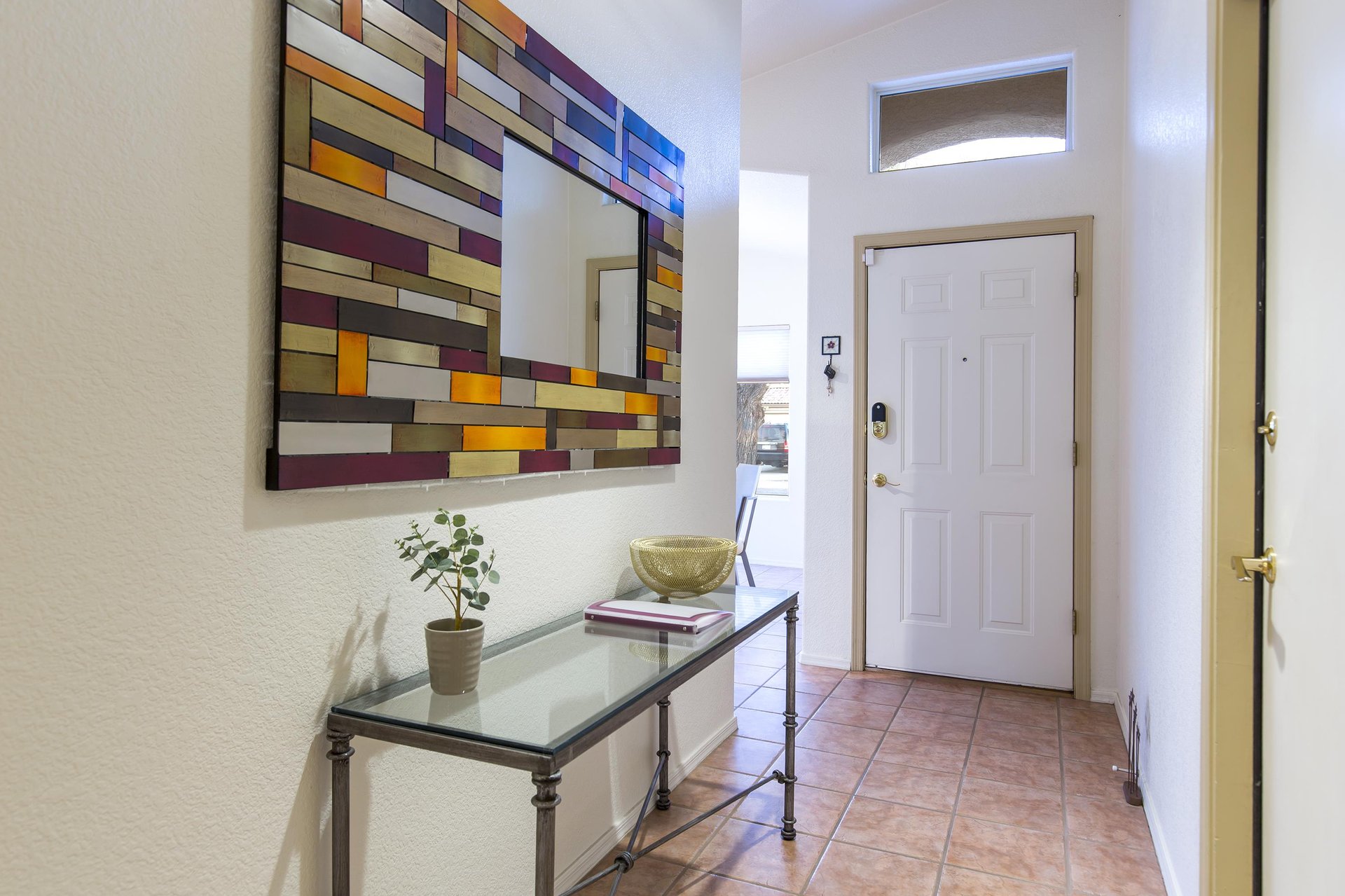 View of front door and entryway into the home