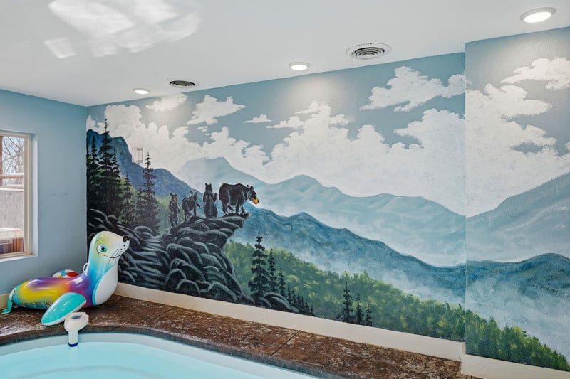 Your kids will love this whimsical mountain mural while enjoying splash time in the pool area.
