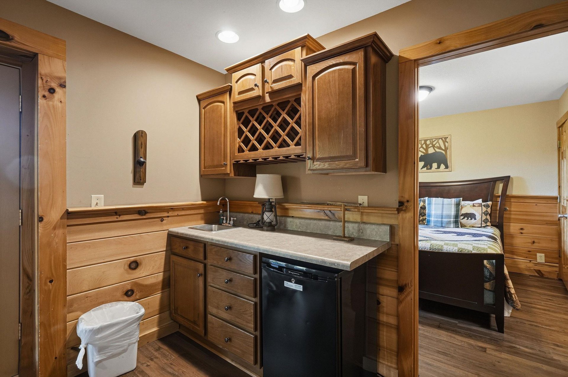 Your fully equipped kitchen features warm wood cabinetry, granite countertops, and modern appliances for preparing meals during your stay.
