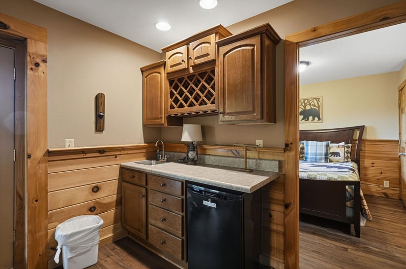 Your fully equipped kitchen features warm wood cabinetry, granite countertops, and modern appliances for preparing meals during your stay.