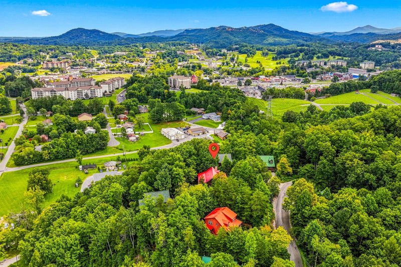 Nestled amid lush rolling hills and forested slopes, the property sits in a scenic mountain valley surrounded by nature and just minutes from the vibrant town center.
