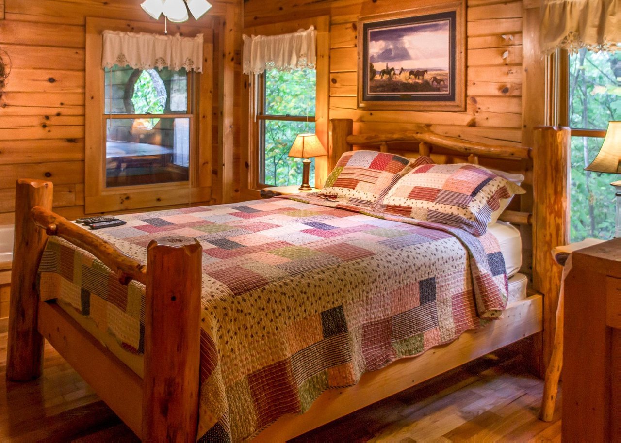 On the first floor youll find a queen bedroom with an attached full bathroom that features a shower stall and pedestal sink.