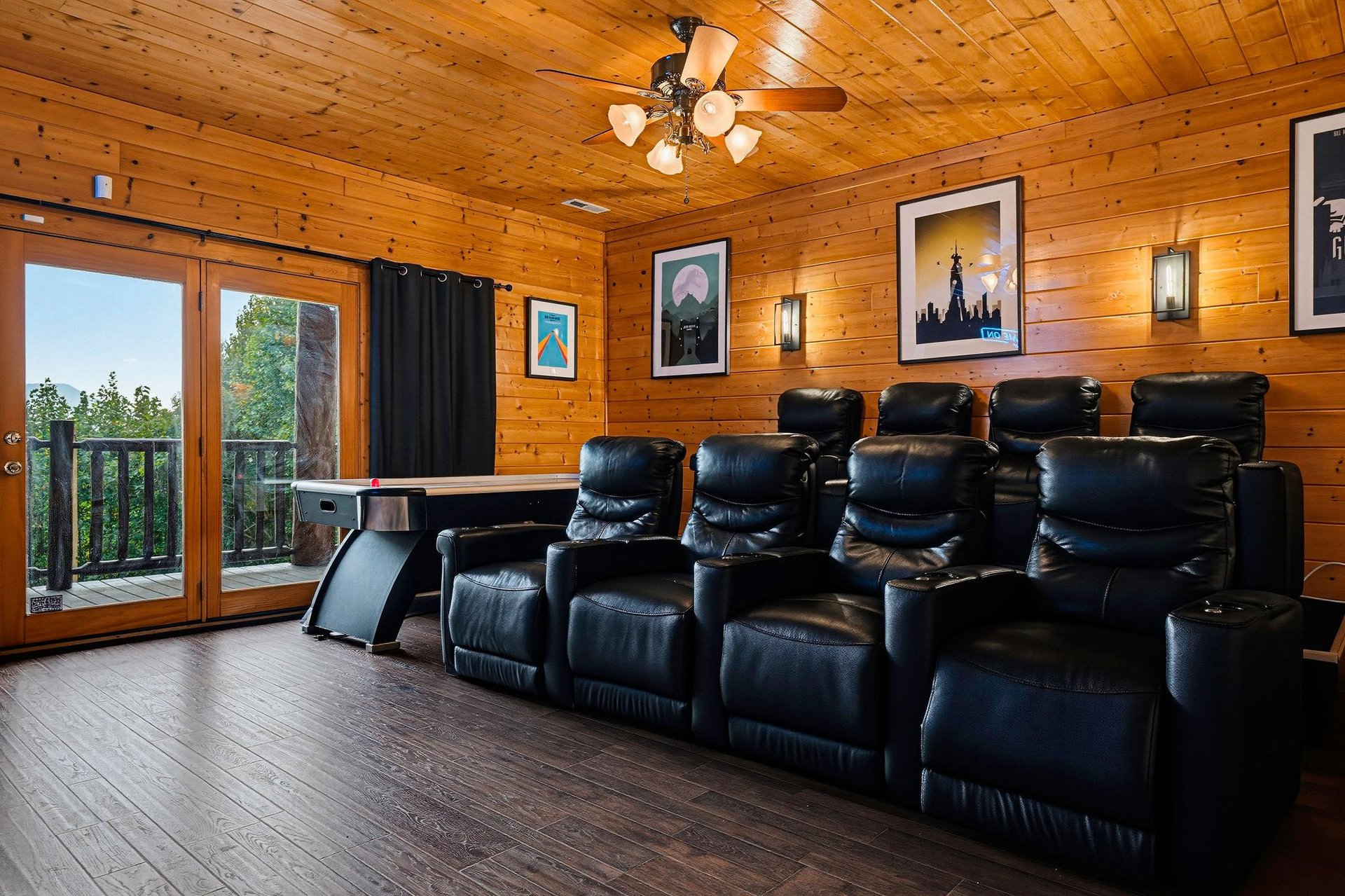 Sink into plush leather recliners in your private theater room, surrounded by warm wood paneling and natural light from the balcony. Perfect for movie nights or bingewatching your favorite shows.