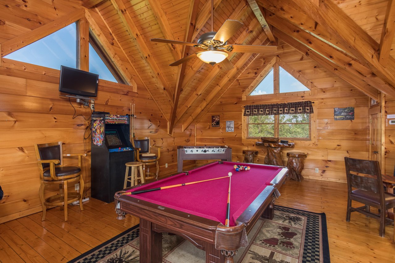 Pool table in the game loft at Graceland, a 4bedroom cabin rental located in Pigeon Forge
