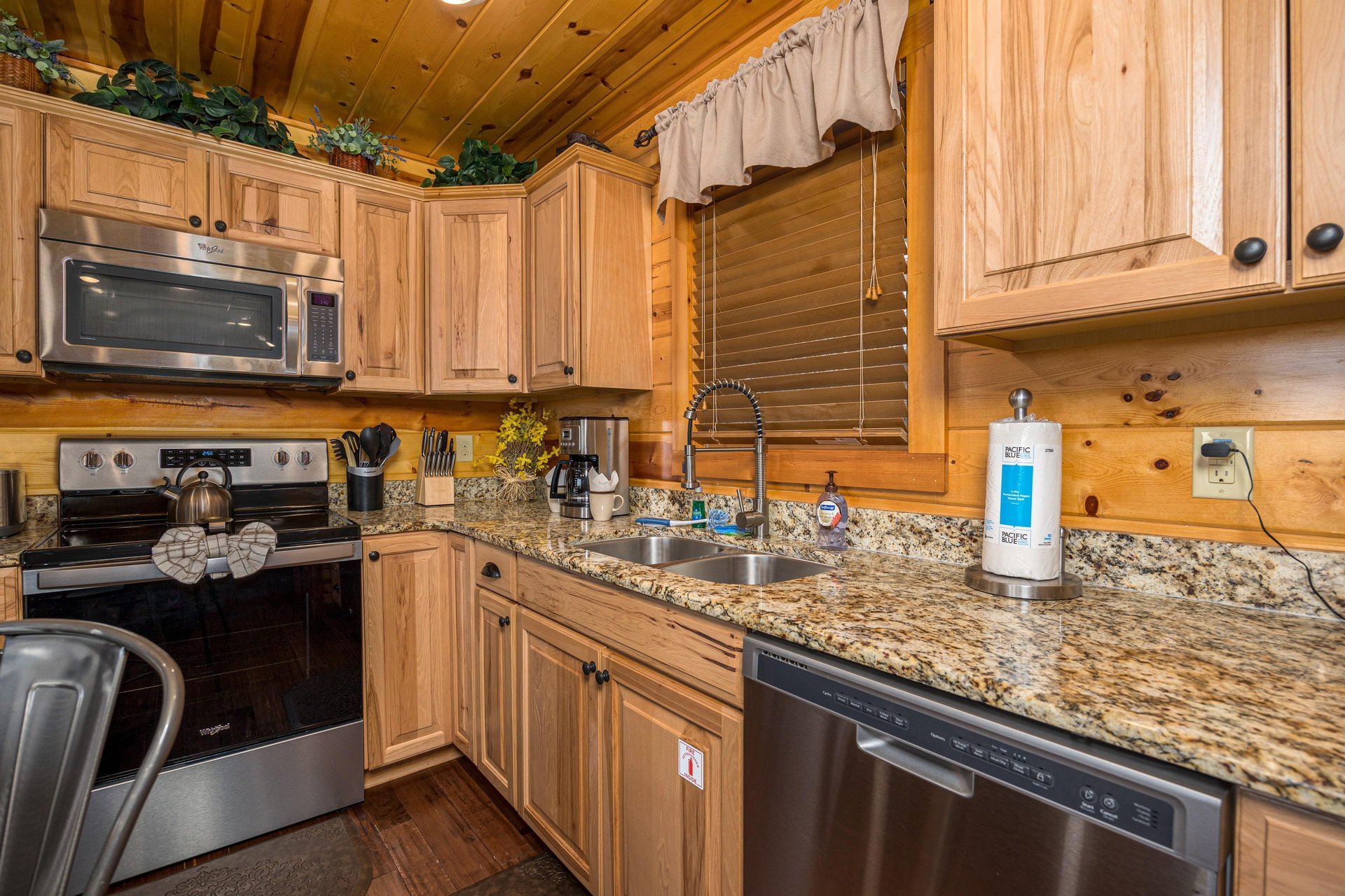 Full kitchen with sink and appliances