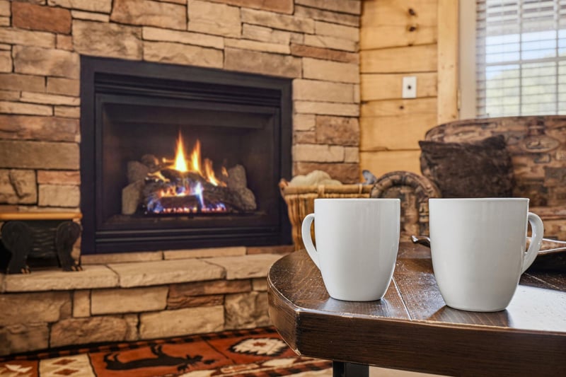 Warm up by the crackling fireplace with a steaming cup of coffee in your hands, surrounded by rustic stone and wood that invites you to unwind completely.