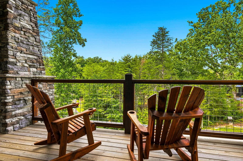 Picture yourself unwinding in these Adirondack chairs on your private balcony, soaking in sweeping views of lush forests and clear blue skies.