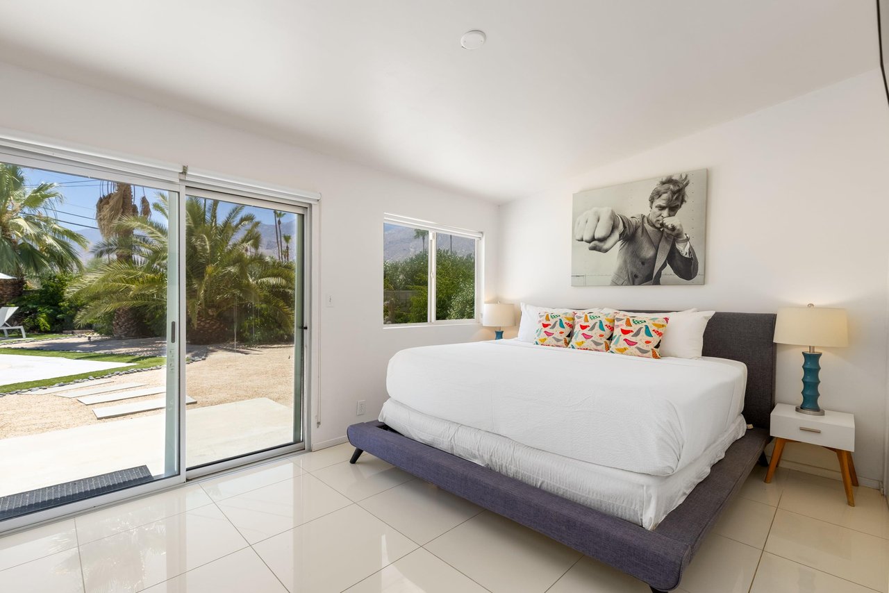King size bed, flatscreen TV, patio access, and ensuite bathroom.