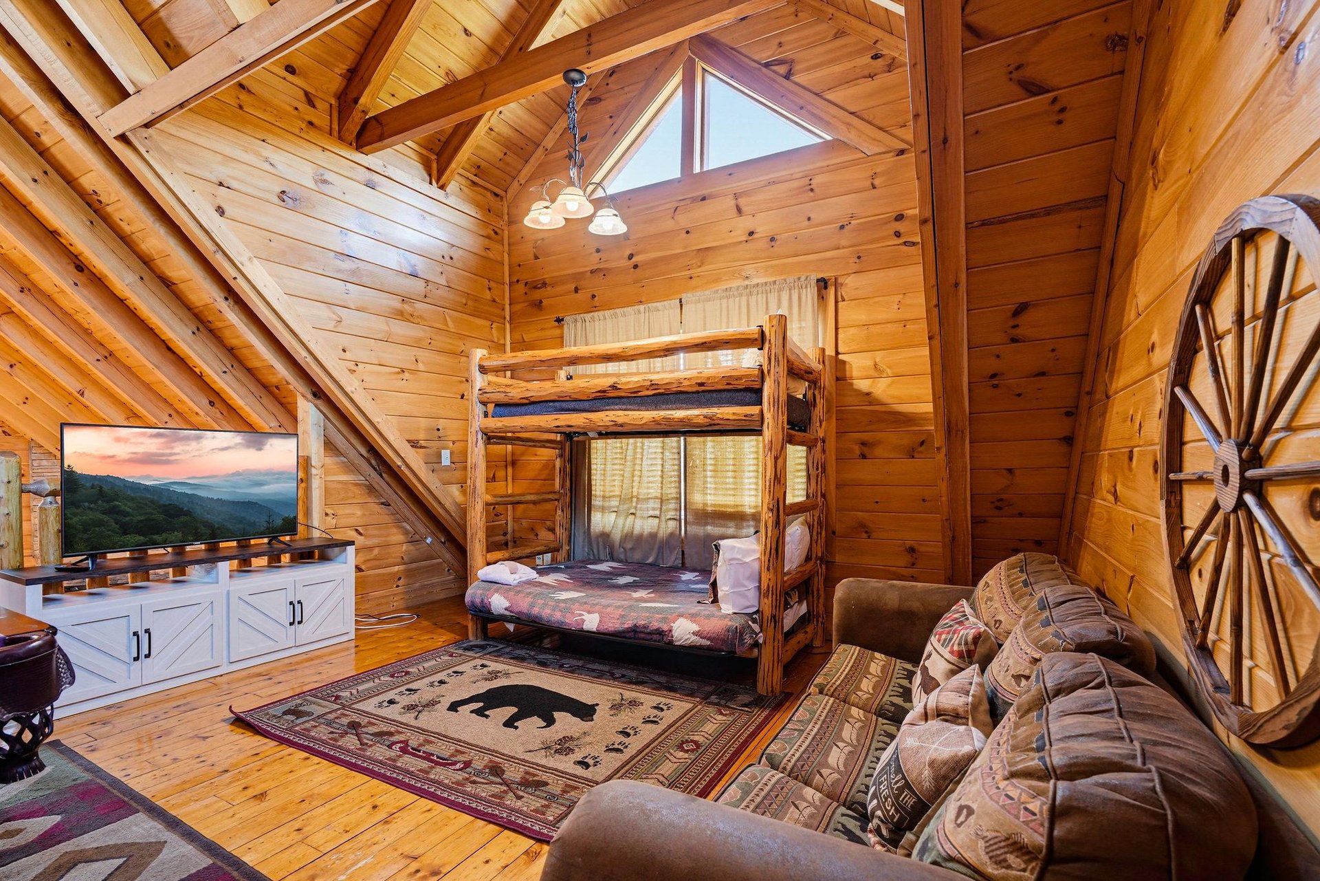 A cozy mountain cabin retreat with handcrafted log bunk beds, vaulted ceilings, and rustic charm—your perfect escape from the everyday.