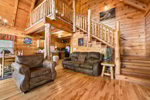 Sofa and chair in the living room at Alpine Sondance, a 2 bedroom cabin rental located in Pigeon Forge