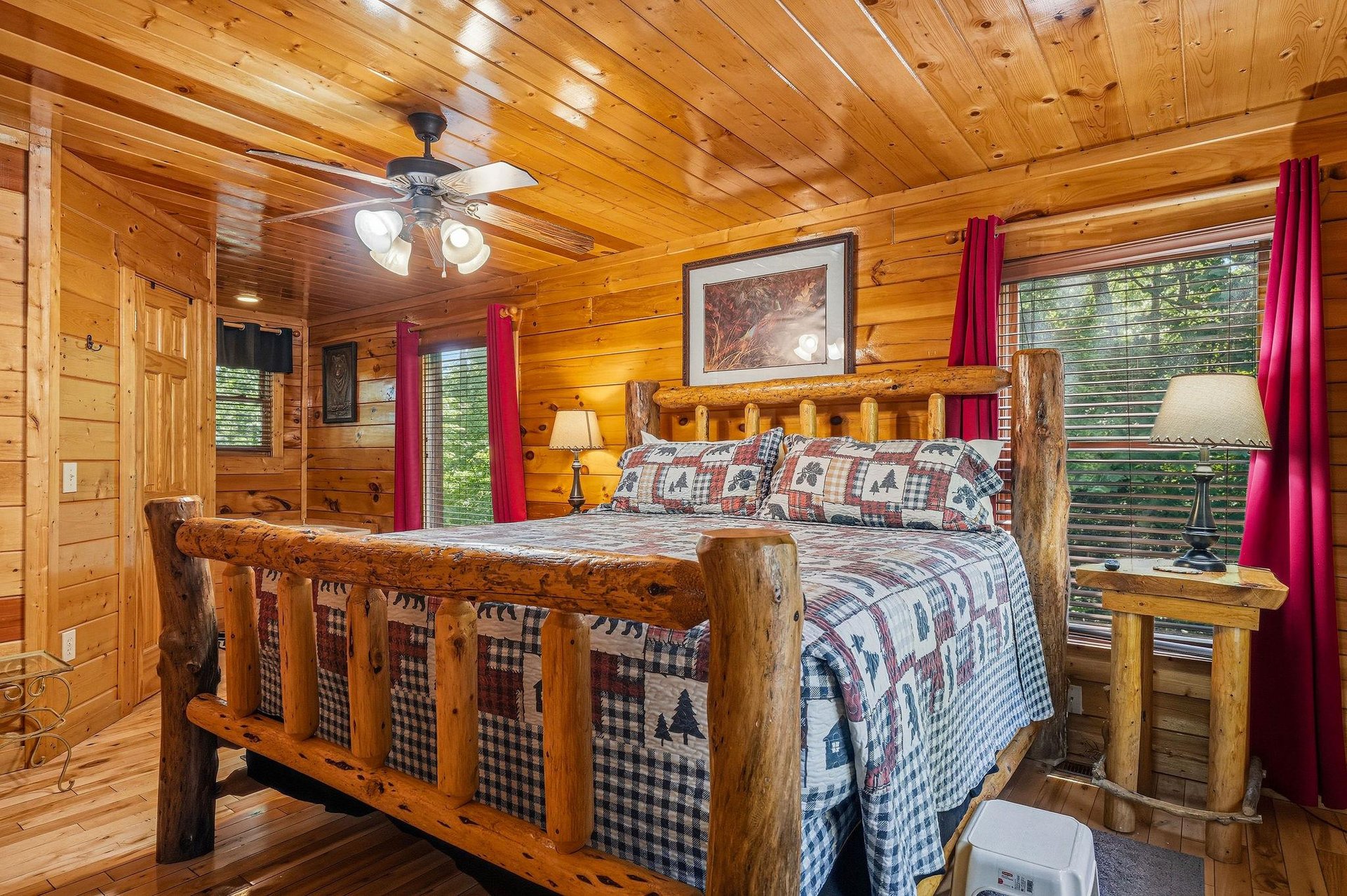 Sink into the handcrafted log bed surrounded by warm pine walls. Fresh forest views through every window invite peaceful mornings and restful nights in your cozy mountain retreat.