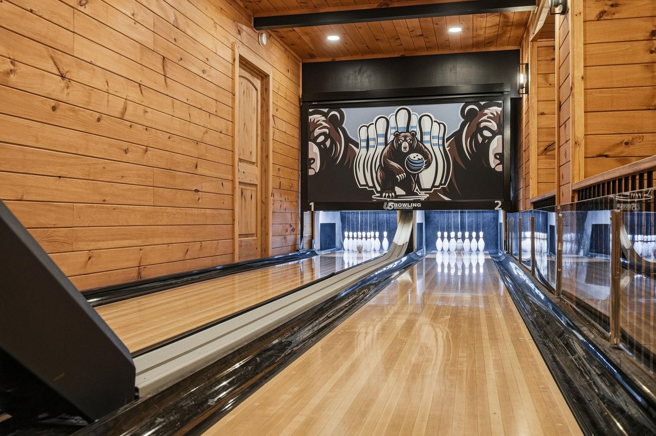 Your own private bowling lanes await—polished wood, playful murals, and the thrill of strikes and spares in your exclusive retreat.