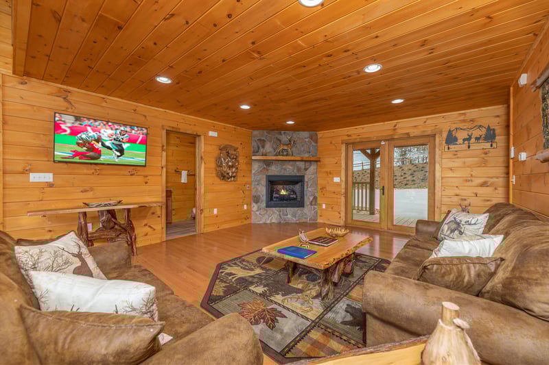 Fireplace and TV in a living room at Js Hideaway, a 4 bedroom cabin rental located in Pigeon Forge